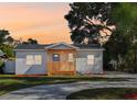 Charming bungalow with a covered porch and landscaped yard at 8413 N 46Th St, Tampa, FL 33617