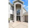 Elegant entryway with arched doorway, large window, and chandelier at 4915 Augusta Ave, Oldsmar, FL 34677