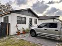 House with gray siding and a silver pickup truck parked in the driveway at 3102 W Leroy St # A, Tampa, FL 33607