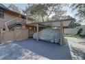 Carport with parking for one car and extra space at 1106 Lennox W Rd, Palm Harbor, FL 34683