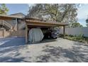 Covered carport provides parking and shade at 1106 Lennox W Rd, Palm Harbor, FL 34683