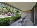 Brick patio with chairs and a view of the parking lot at 36750 Us Highway 19 N # 09110, Palm Harbor, FL 34684