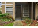 Private condo entrance with screened porch and walkway at 14323 Hanging Moss Cir # 102, Tampa, FL 33613