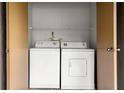 Condo laundry closet with washer and dryer included at 14323 Hanging Moss Cir # 102, Tampa, FL 33613