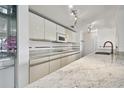 Modern kitchen with granite countertops and stainless steel appliances at 36750 Us Highway 19 N # 04208, Palm Harbor, FL 34684