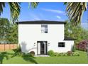 Back of house featuring a patio and backyard access at 12905 Worchester Ave, Tampa, FL 33624