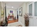 Bright entryway with hardwood floors and decorative accents at 36750 Us Highway 19 N # 05213, Palm Harbor, FL 34684
