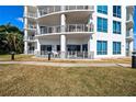 Beautiful white building with balconies and manicured landscaping at 1209 E Cumberland Ave # 508, Tampa, FL 33602