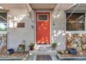 Inviting front door with terracotta color and potted plants at 5608 26Th S Ave, Gulfport, FL 33707