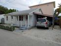 Cute bungalow-style home with carport and small front yard at 131 92Nd Ave, Treasure Island, FL 33706