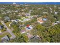 Single-Gathering home with a spacious backyard and large tree near the water at 2820 W Leila Ave, Tampa, FL 33611