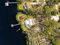Bird's-eye view of waterfront home with pool and dock at 505 S 56Th St, Tampa, FL 33619