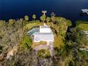 Waterfront home with pool, dock, and lush landscaping at 505 S 56Th St, Tampa, FL 33619