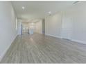 Spacious living room with grey wood-look floors at 2010 1/2 E Wood St # St, Tampa, FL 33604