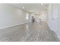 Spacious living room with grey wood-look floors at 2010 1/2 E Wood St # St, Tampa, FL 33604