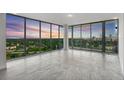 Spacious living room with floor to ceiling windows and city views at 777 3Rd N Ave # 1203, St Petersburg, FL 33701