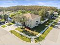 Aerial view of a two-story house on a corner lot with a three-car garage at 17800 Souter Ln, Land O Lakes, FL 34638