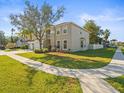 Two-story house with a three-car garage and landscaping at 17800 Souter Ln, Land O Lakes, FL 34638