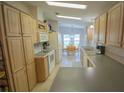 Kitchen boasts ample cabinetry and a breakfast nook at 37449 Gill Ave, Zephyrhills, FL 33541