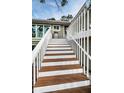 Exterior stairs leading to home entrance at 302 Lagoon Dr, Palm Harbor, FL 34683