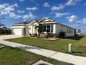 Two-car garage home with curb appeal at 1027 Ocean Spray Dr, Ruskin, FL 33570