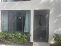 Exterior view of condo front door and windows at 3358 Mermoor Dr # 2106, Palm Harbor, FL 34685