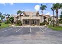 Exterior of a two-story condominium building with stairs and covered patios at 2571 Cyprus Dr # 1-202, Palm Harbor, FL 34684