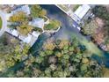 High-angle view of waterfront property and surrounding waterways at 6194 Bear Trl, Weeki Wachee, FL 34607