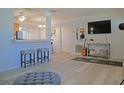 Living room with light gray laminate flooring at 2855 52Nd N Ln, St Petersburg, FL 33710