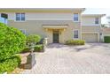 Townhouse entrance with paved driveway at 1357 Emerald Dunes Dr, Sun City Center, FL 33573