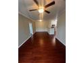 Living room with hardwood floors and ceiling fan at 18001 Richmond Place Dr # 425, Tampa, FL 33647