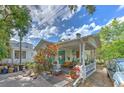 Quaint house with a covered porch and teal accents at 4605 S Bartlett St, Tampa, FL 33611