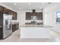 Bright open kitchen with granite countertops, stainless steel appliances, and a central island at 15876 Mulrion Blvd, Punta Gorda, FL 33982