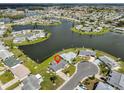 Aerial view showcasing home's waterfront location in community at 1705 Bryn Mawr Ave, Sun City Center, FL 33573