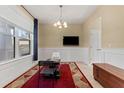Dining room with a chessboard table and a TV at 9157 Bella Vita Cir, Land O Lakes, FL 34637