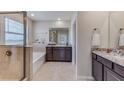 Elegant bathroom with soaking tub and double vanity at 18009 Tavernside Trl, Lakewood Ranch, FL 34211
