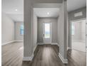 Inviting foyer with a front door and views of adjacent rooms with attractive flooring at 12152 Snow Bird Ave, Port Charlotte, FL 33981