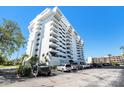 Angled view of the condo building highlighting multiple floors and surrounding parking area at 30 Turner St # 401, Clearwater, FL 33756