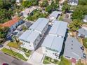 An aerial view of the new construction townhomes with fresh silver roofs and manicured yards at 407 S Albany Ave # 2, Tampa, FL 33606