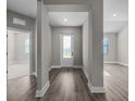 Bright entryway with hardwood floors leads into the main living areas at 5227 Dayton Ln, Port Charlotte, FL 33981