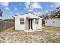 A charming bungalow-style home with a covered porch and well-maintained yard at 7125 Colfax Dr, Port Richey, FL 34668