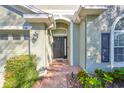 Home's exterior entrance with walkway at 1148 Emerald Hill Way, Valrico, FL 33594