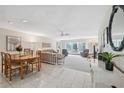 Open concept dining area with adjoining living room at 3942 Trophy Blvd, New Port Richey, FL 34655