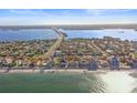 Aerial view of coastal community near the ocean at 1020 Palm Dr, Belleair Beach, FL 33786