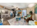 Living room with spiral staircase and stone floors at 3120 Beach S Blvd # 7, Gulfport, FL 33707