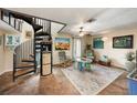 Living room with spiral staircase and stone floors at 3120 Beach S Blvd # 7, Gulfport, FL 33707