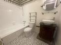 Bathroom with updated vanity and bathtub at 8221 12Th N Way # E, St Petersburg, FL 33702