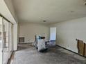 Empty living room awaiting renovation with exposed walls and floors at 4354 50Th S Ter, St Petersburg, FL 33711