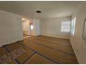 Large living area with vinyl flooring, and access to other rooms at 469 80Th Way, St Pete Beach, FL 33706