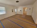 Spacious living room with light walls and vinyl flooring at 469 80Th Way, St Pete Beach, FL 33706